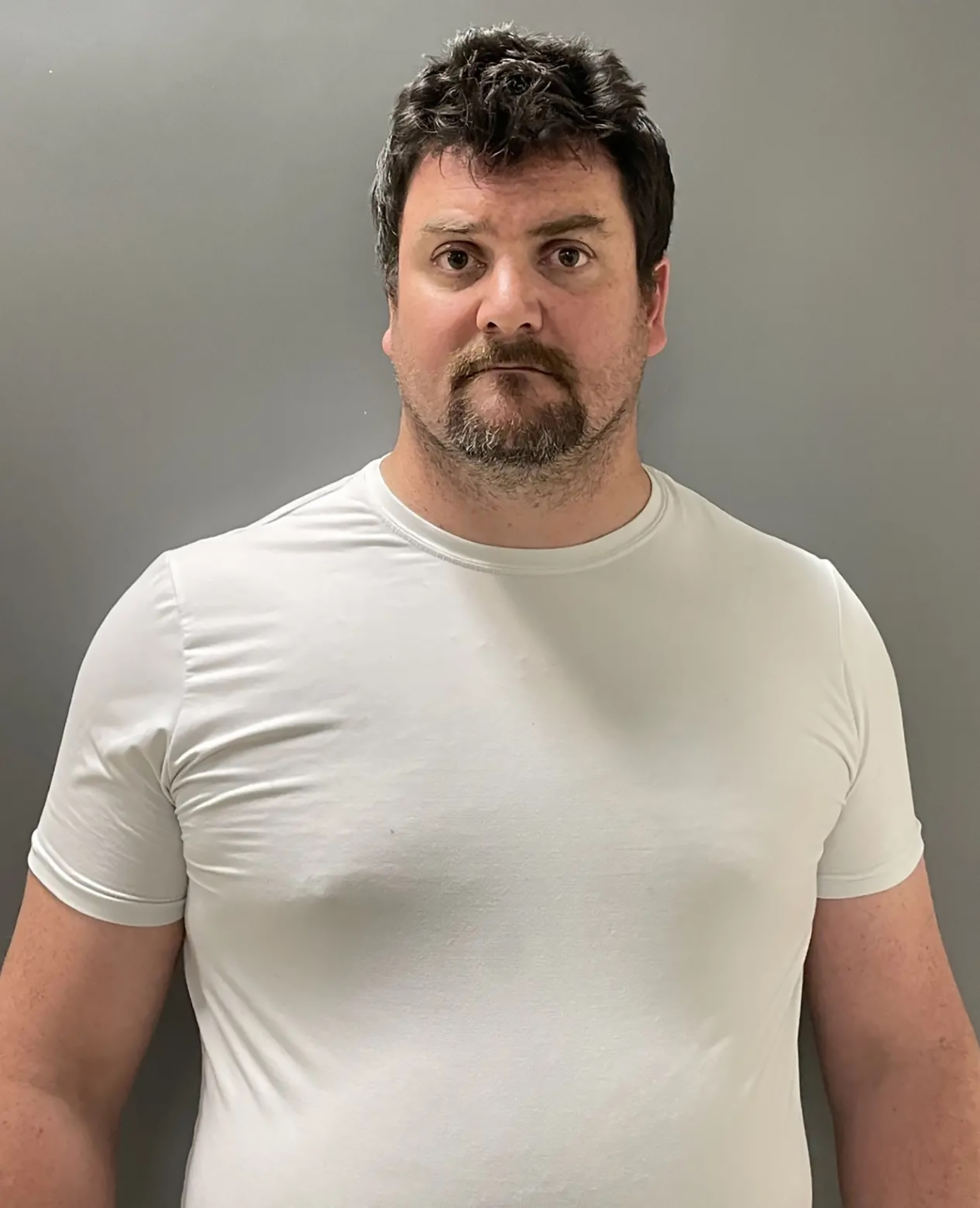 School employee accused of secretly filming 12 girls in changing room faces new charges